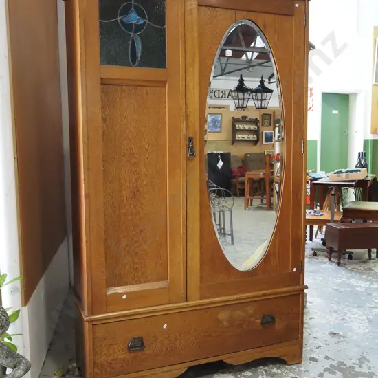 solid oak wardrobe with 1 lower drawer, 1 door with insert oval mirror, small leadlight pane H1990 W1160 D460
