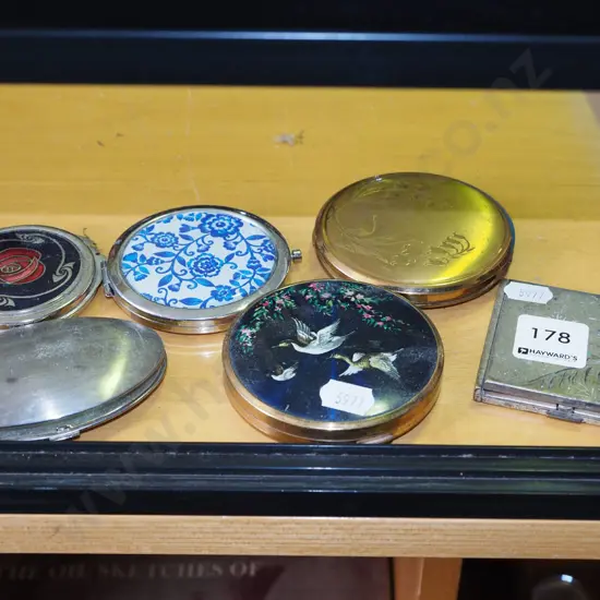 assorted powder compacts, mirror