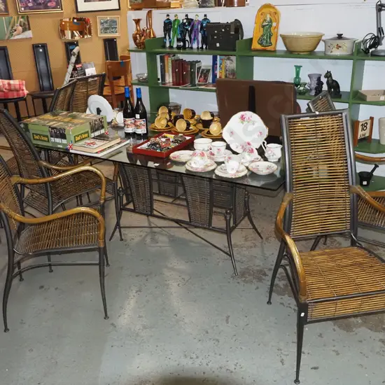 contemporary metal based glass top dining table with 6 matching bamboo and cane upholstered carver chairs H740 W1700 D10