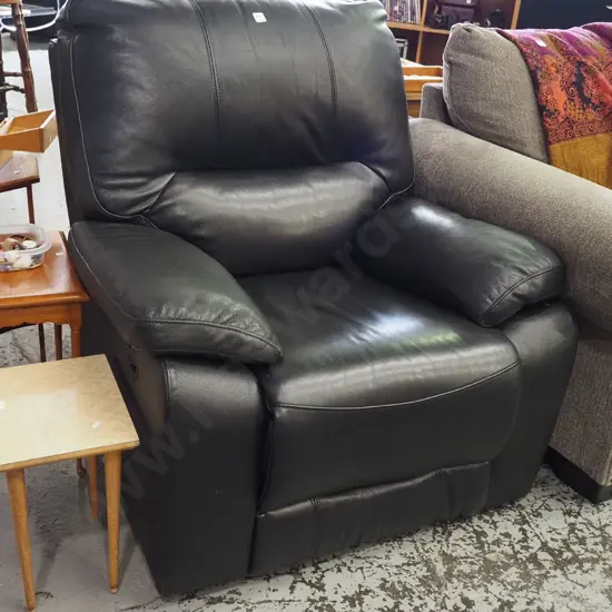 black leather upholstered reclining armchair
