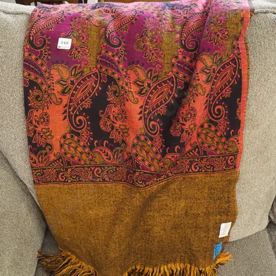 paisley decorated fringed throw