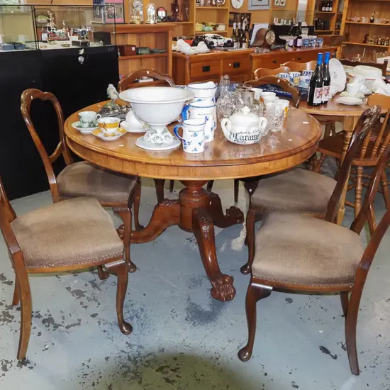 Victorian carved mahogany claw and ball foot pedestal loo table with 6 matching mahogany cab leg balloon back chaors 