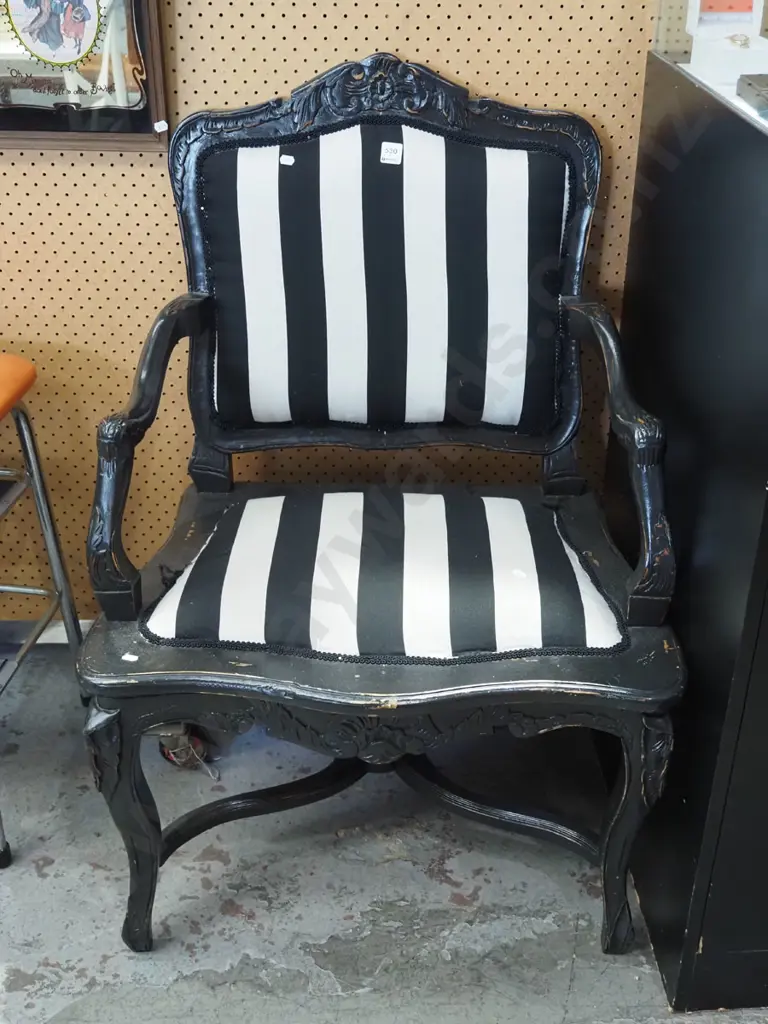 carved black painted wooden armchar with black and white upholstery Image 1++