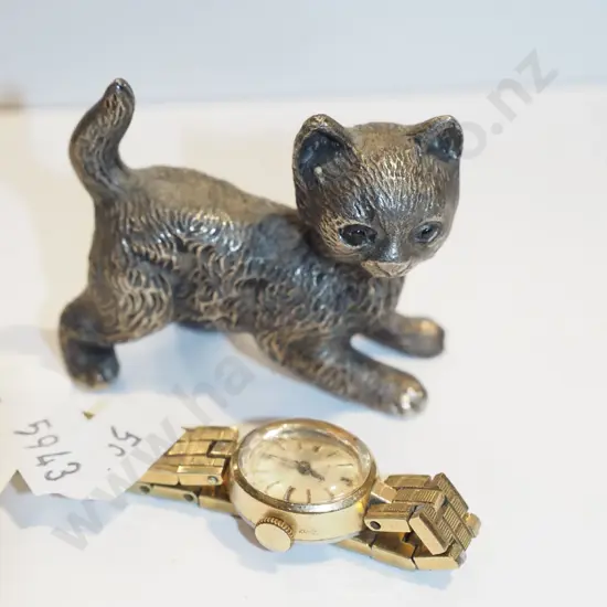 small cast metal cat figurine, ladies wristwatch
