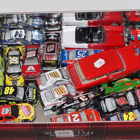 tin of toy vehicles