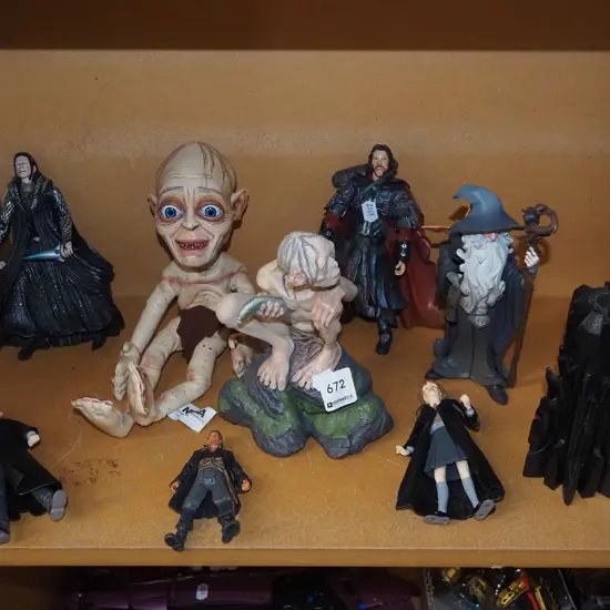 shelf of movie figurines H180