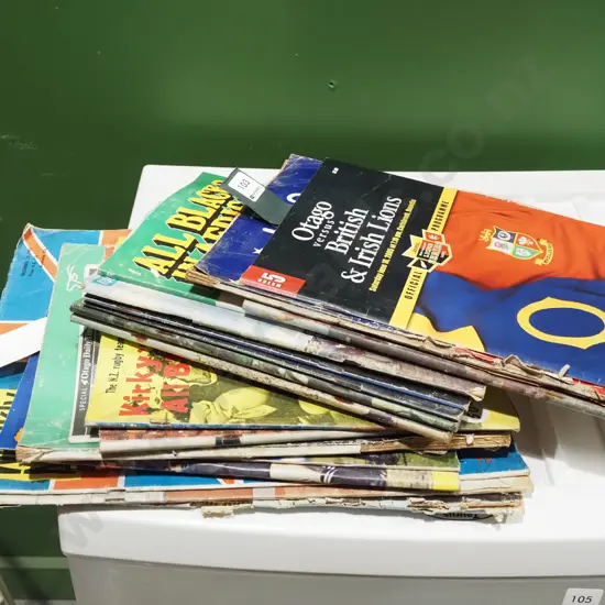 stack of assorted rugby programmes