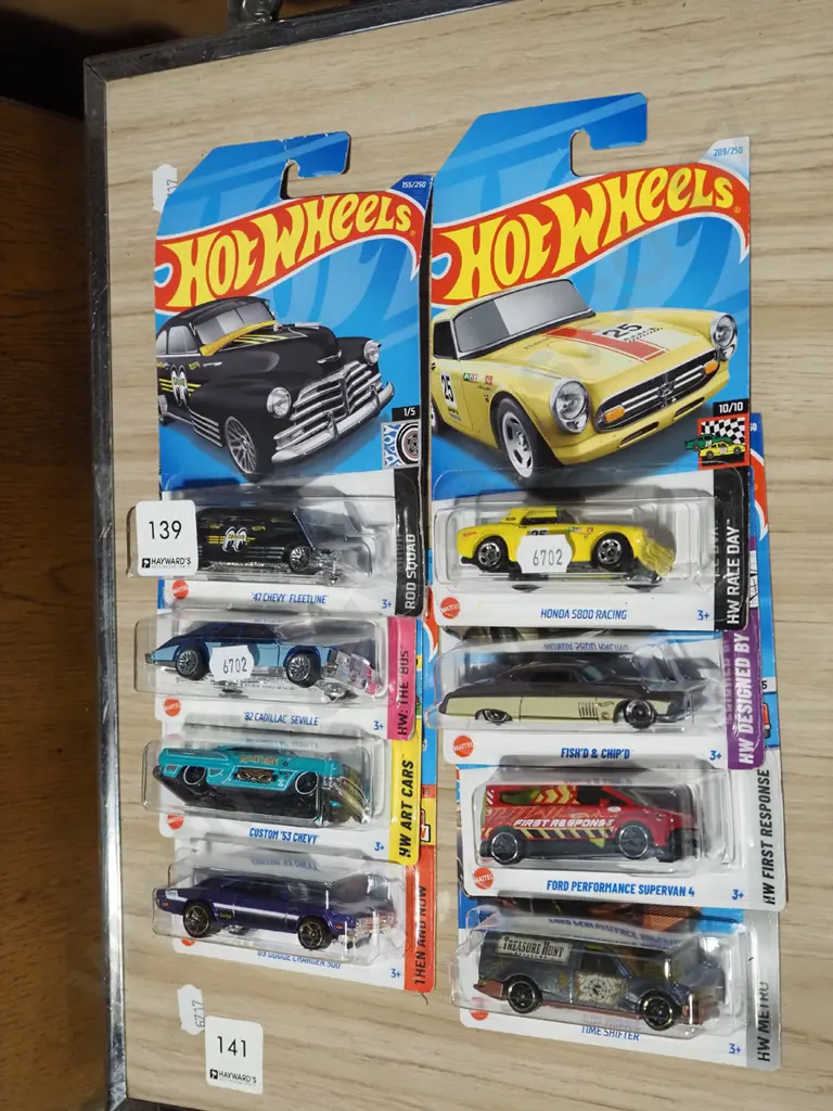 8x as new carded Hotwheels vehicles Image 1++