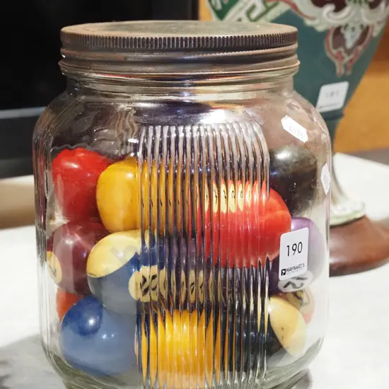 vintage glass jar of pool balls