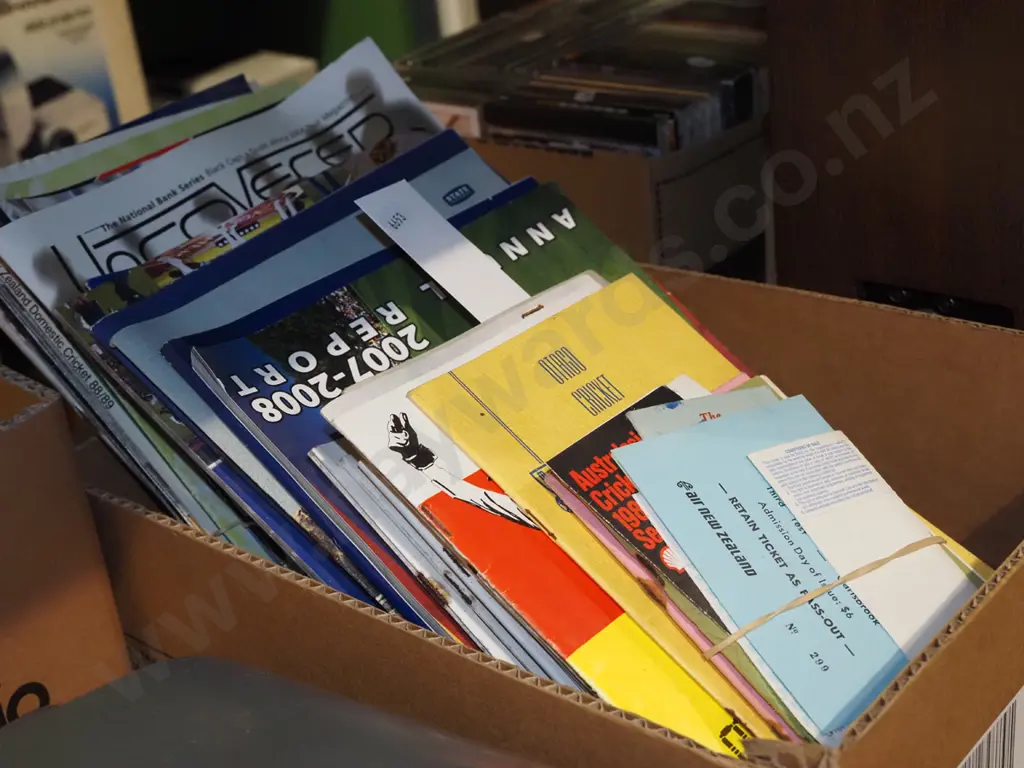 box of sporting programmes Image 1++
