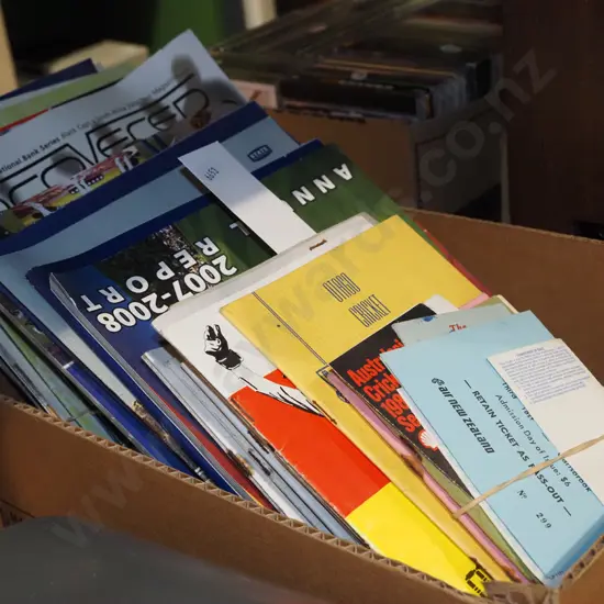 box of sporting programmes