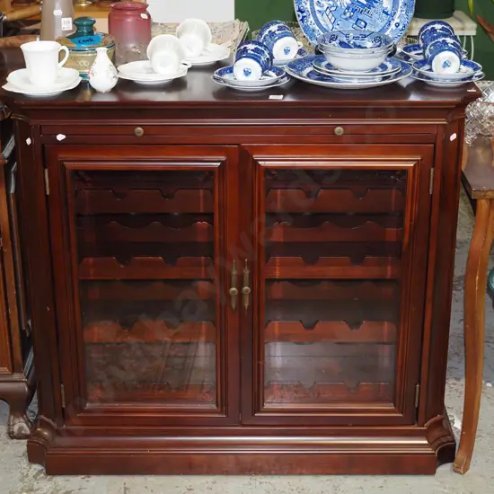 mahogany cabinet with 2 glazed doors, internal wine rack, pull out tray shelf  H840 W950 D410