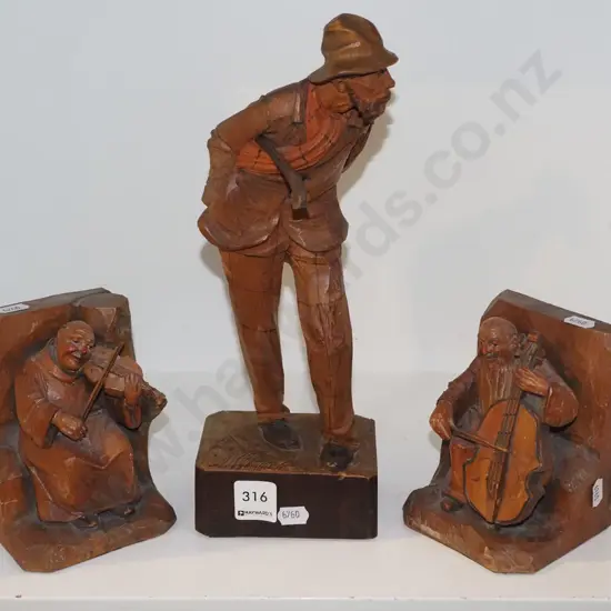 hand carved European figurine, carved bookends