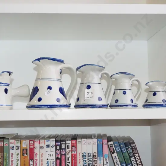 5x small graduated studio pottery jugs 