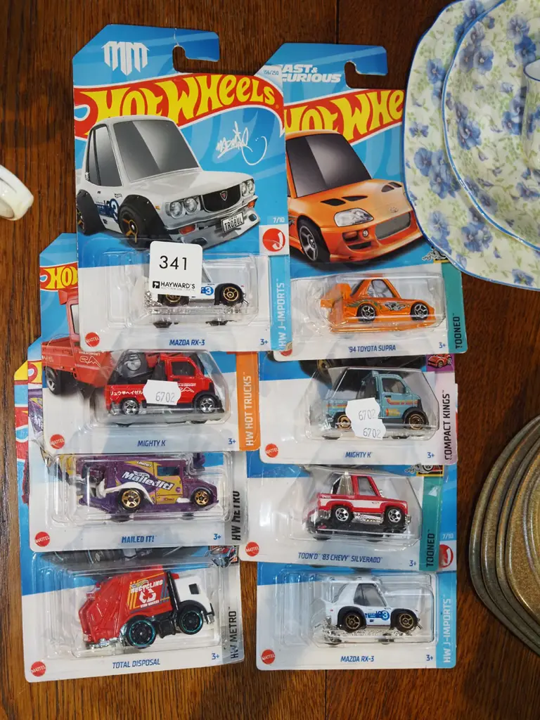 8x as new carded Hotwheels vehicles Image 1++