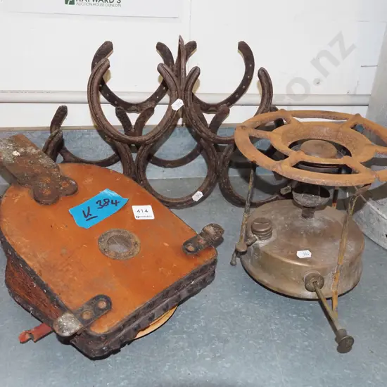 rusty Primus gas stove, vintage foot pump, horse shoe wine rake