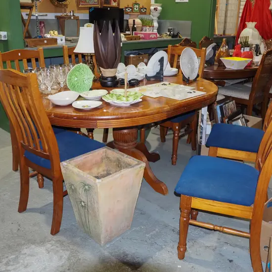 pine extending pedestal dining table with 6 blue upholstered chairs H770 W1600 D1200