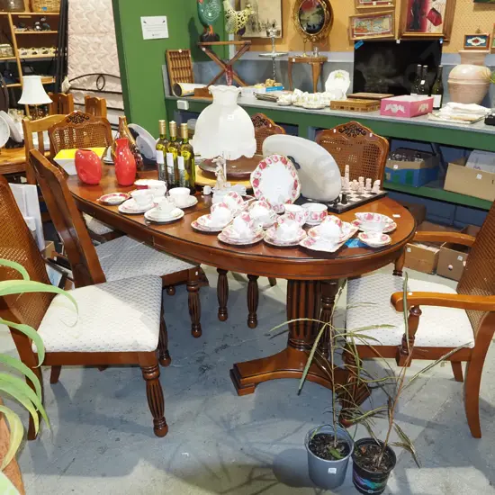 reproduction mahogany veneer extending twin pedestal dining table with 4 rattan back chairs