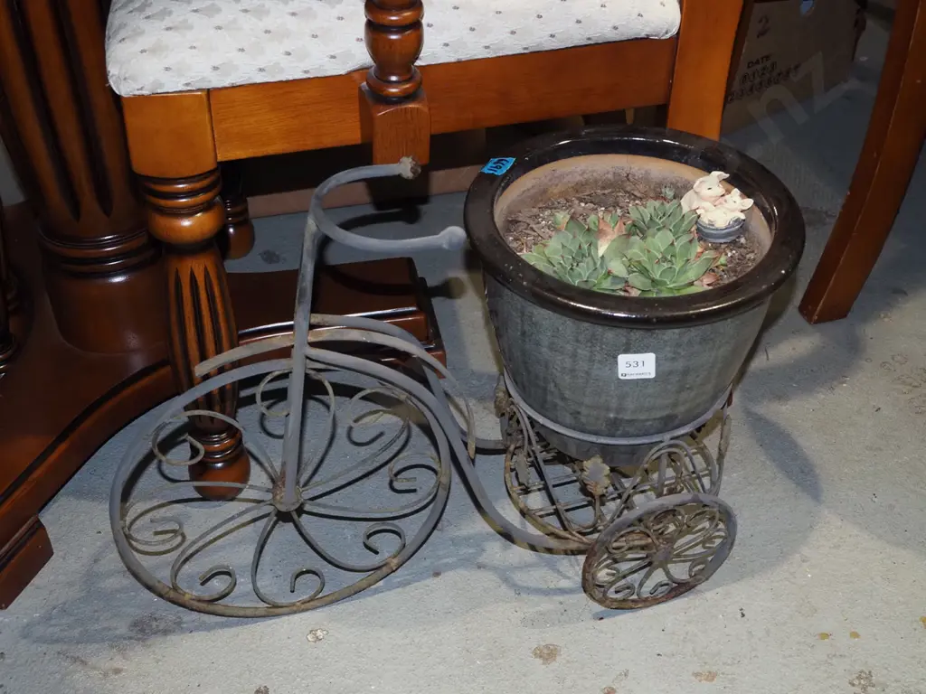 succulents in black planter on metal bike stand Image 1++
