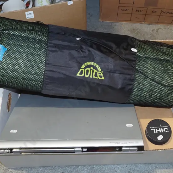 box; DVD player, ice hockey puck, camping mat