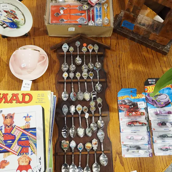 boxed souvenir teaspoons and rack with spoons - red dots