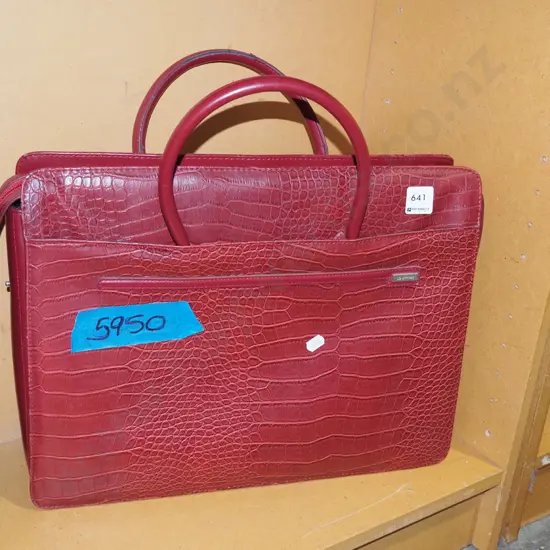 red vinyl hand bag