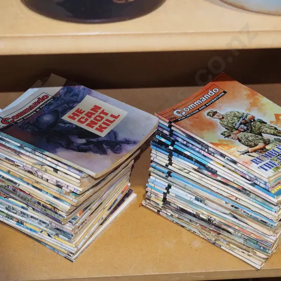 2x stacks of Commando magazines