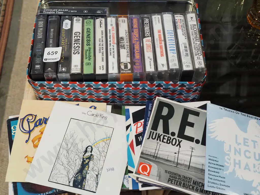 tin of CDs and tape cassettes Image 1++