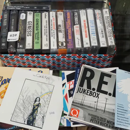 tin of CDs and tape cassettes