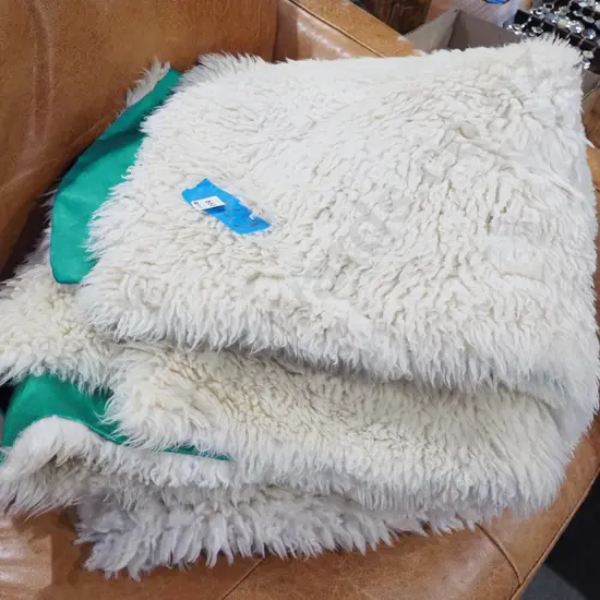 white sheepskin floor mat with green fabric backing L1800 Wapprox1400