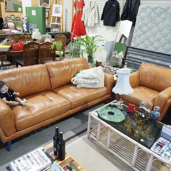 brown leather 2 piece lounge suite - 3 seater and 1 single - good condition apart from some staining to settee