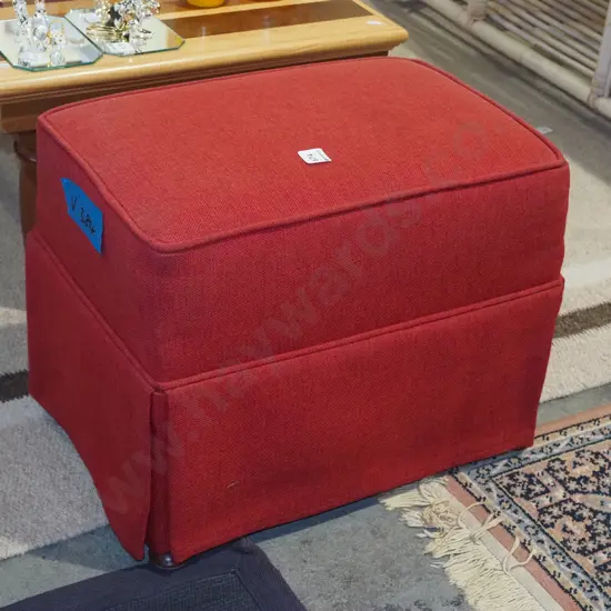 red upholstered ottoman