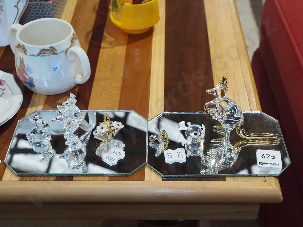 various cut crystal ornaments on mirrored base Image 1++
