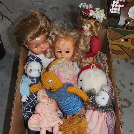 box of dolls and toys