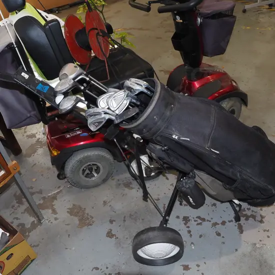 Wilson golf clubs and trundler