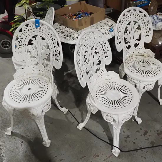 cast alloy patio table and 4 matching chairs