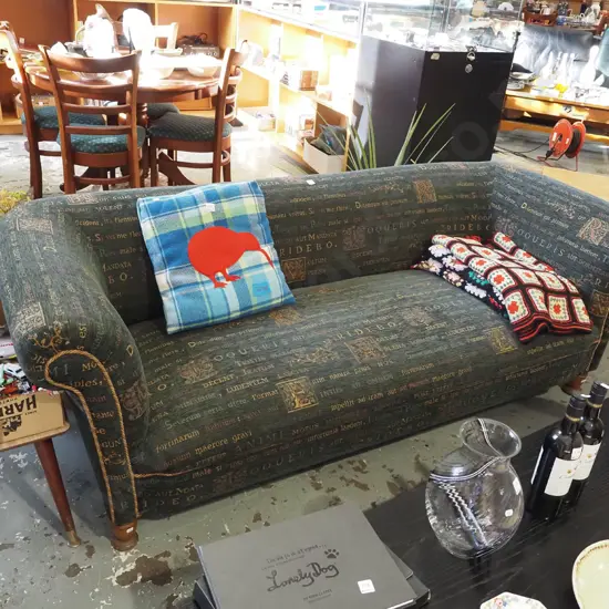 rolled arm chesterfield 3 seater settee with Latin phrases and floral upholstery