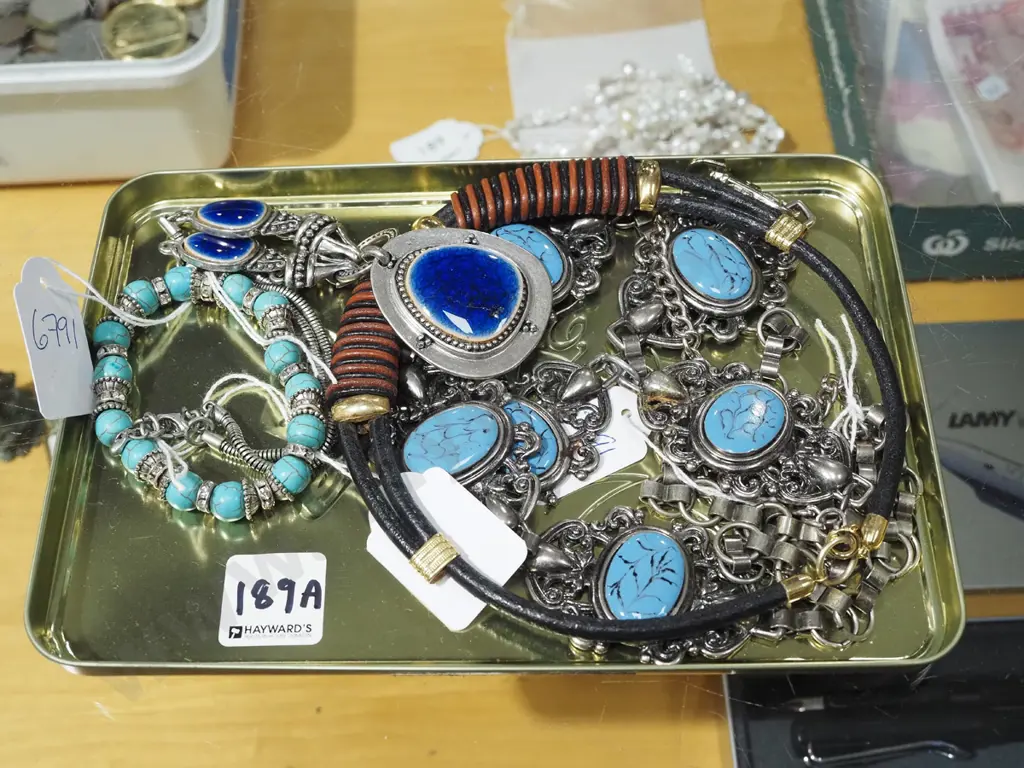 metal tray of costume jewellery necklaces and bracelets Image 1++