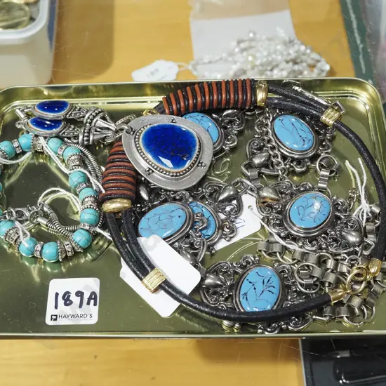 metal tray of costume jewellery necklaces and bracelets
