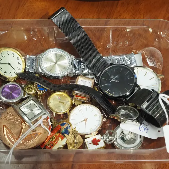 tray of watches and watch parts