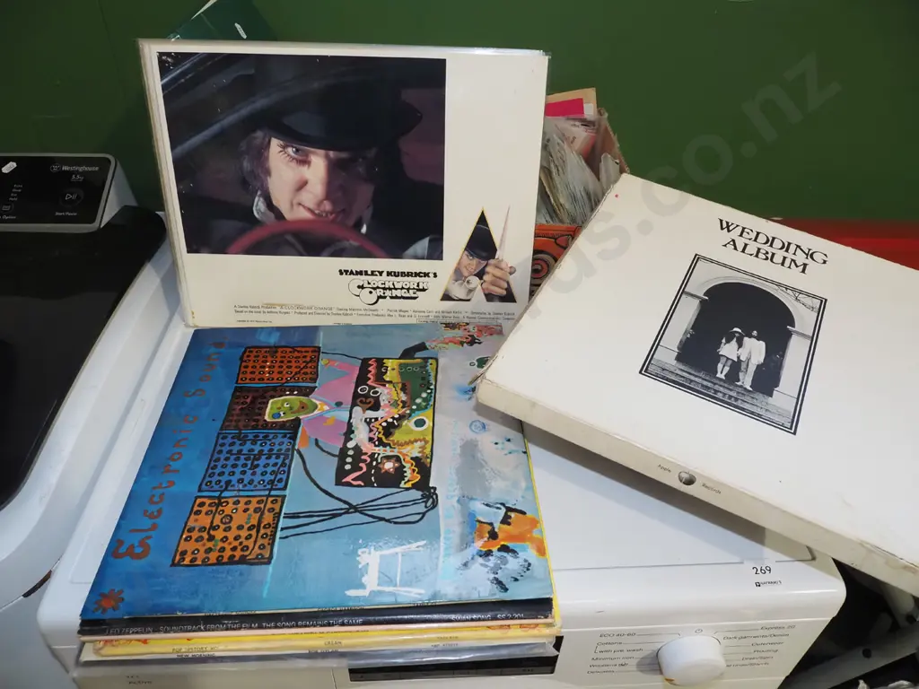 Clockwork Orange laminated promo sheets and assorted LPs: Led Zeppelin, George Harrison, John & Yoko etc. Image 1++