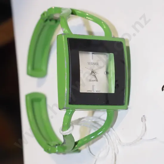 green bangle style wristwatch