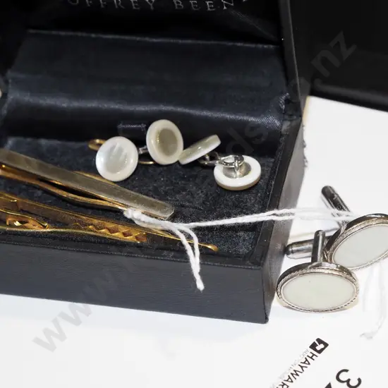 container of cufflinks & tie clips