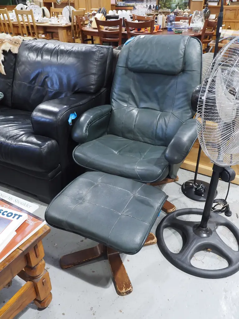green vinyl upholstered swivel chair with matching footstool Image 1++