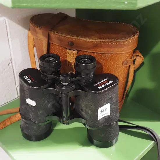 pair of Super Optic 16x50 field binoculars