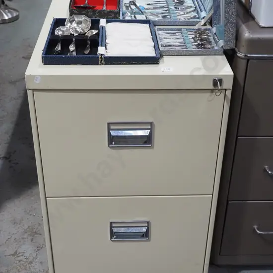 cream 2 drawer filing cabinet - key in office