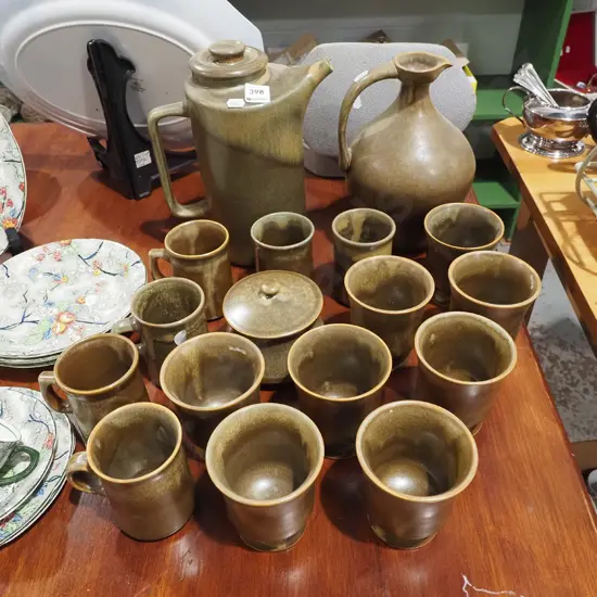 Temuka pottery coffee cups, lidded sugar, stopppered jug etc 