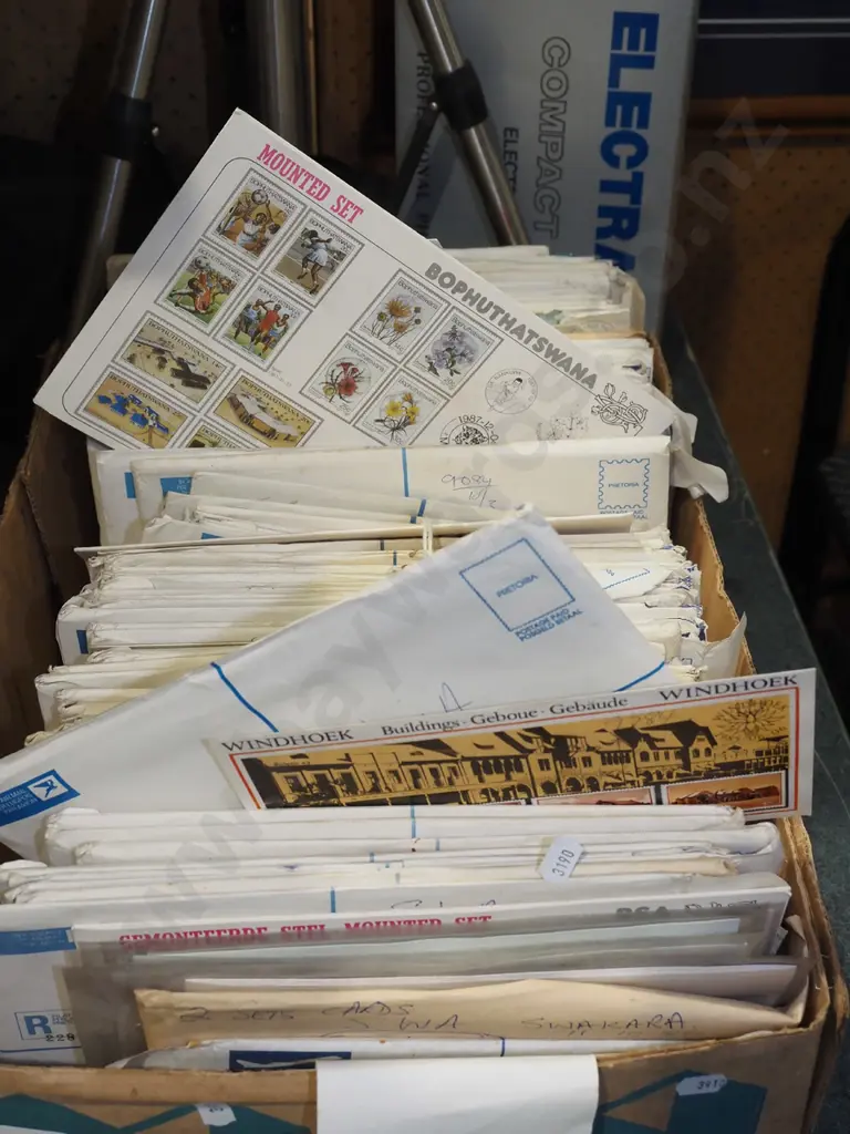 box of numerous stamp sets in envelopes Image 1++