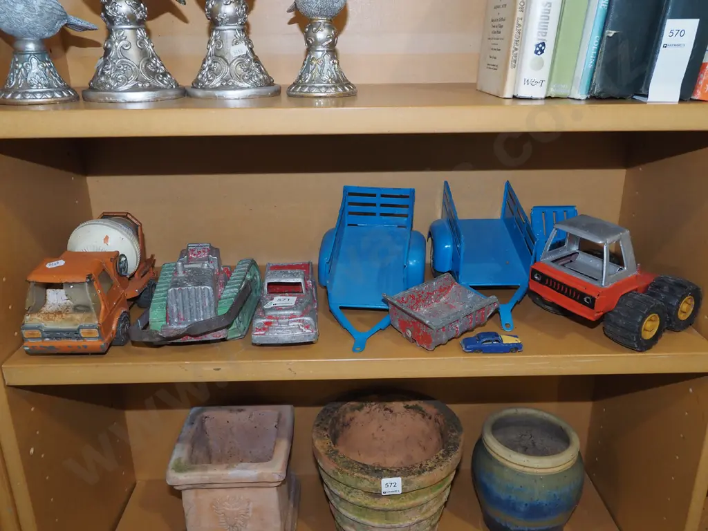 shelf of restorer's toy vehicles Image 1++