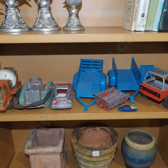 shelf of restorer's toy vehicles
